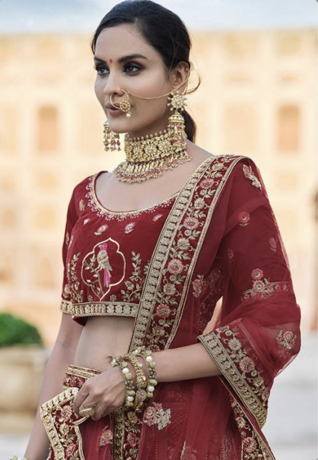 Photo of heavy bridal jewellery with maroon lehenga