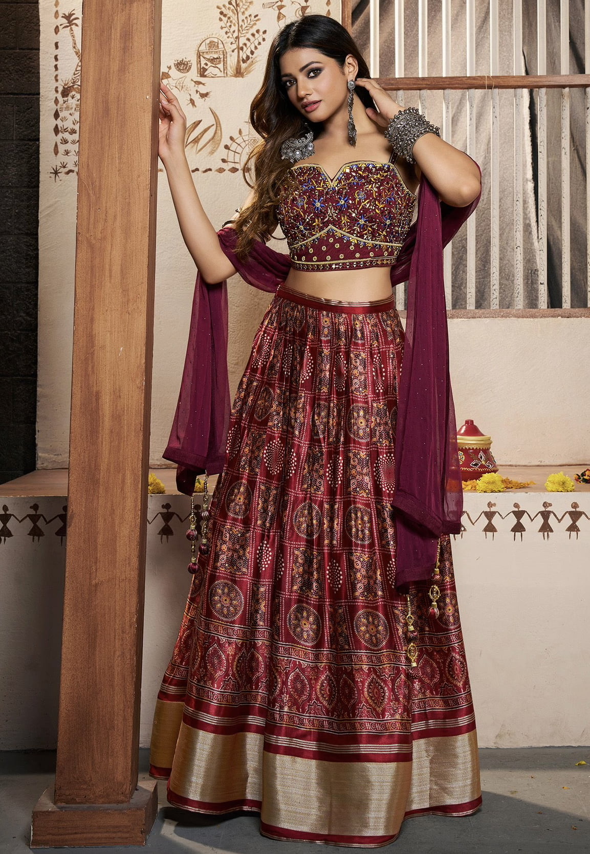 Bridal lehenga paired with maroon color heavily embellished choli and net  dupatta with heavy embroidered border. |lovelyweddingmall.com|